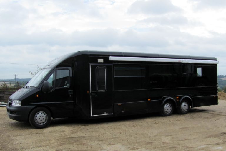 Bespoke vehicle solutions showing a black bus which has been converted into a catering vehicle
