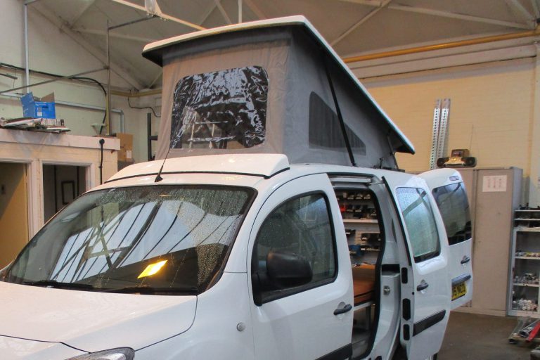 Camper van elevating roof