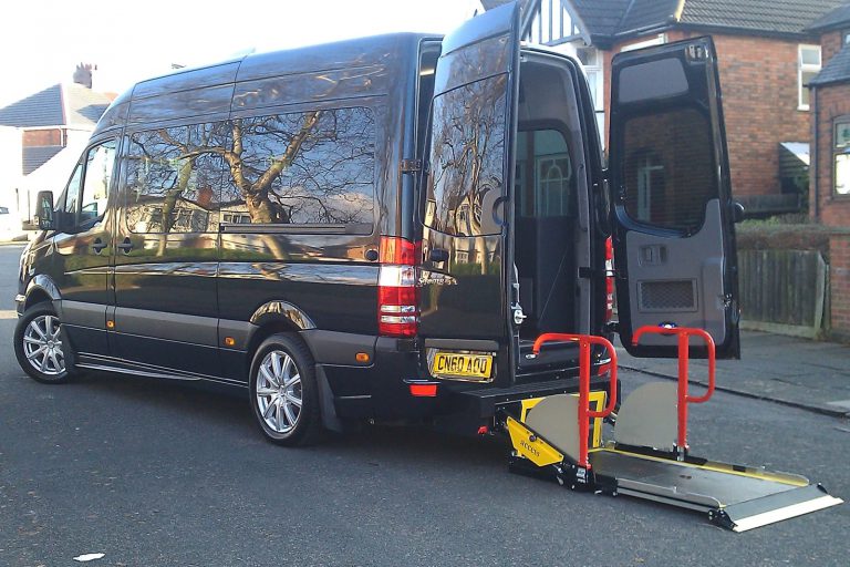 Minibus with rear passenger lift