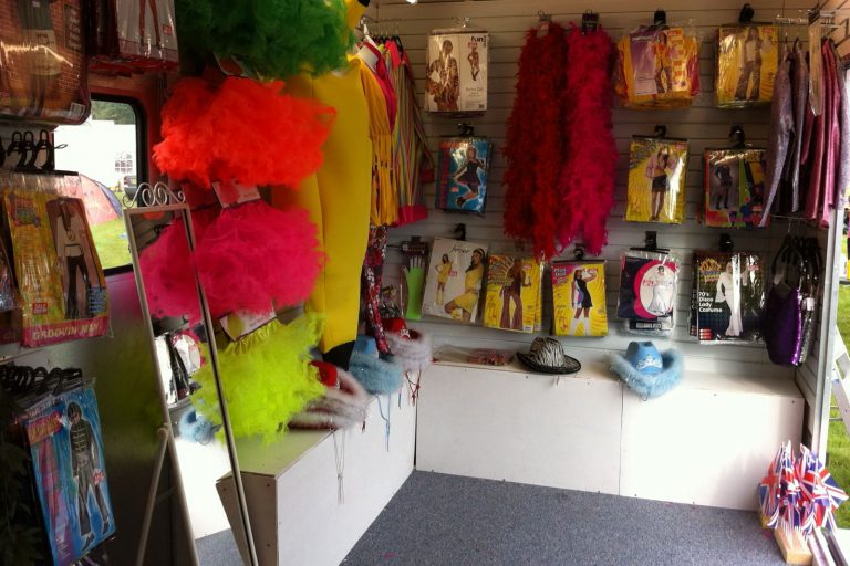 Interior of one of our retailing kiosks featuringclothing and fancy goods