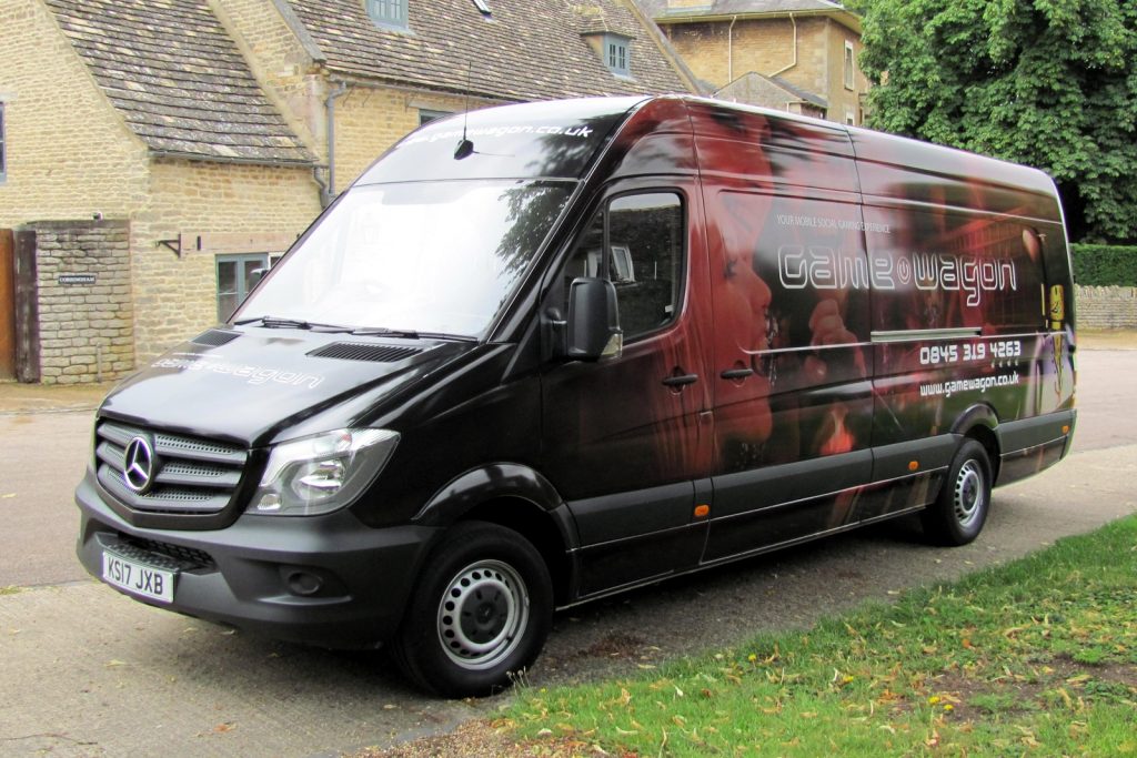 exterior view of a mercedes sprinter with the full Gaming Van wraphics wrap