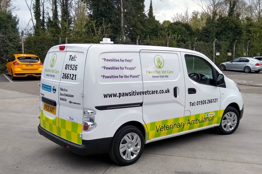 offside view of the Nissan electric van with pawsitive vet care livery