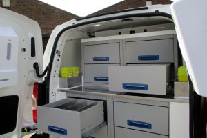 a veterinary ambulance interior with drawers open to highlight the storage space