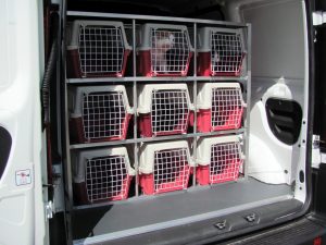 small animal carriers in the rear of an Animedix animal welfare vehicle