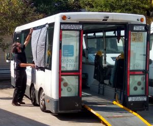 outreach bus conversion with window damaged by vandals