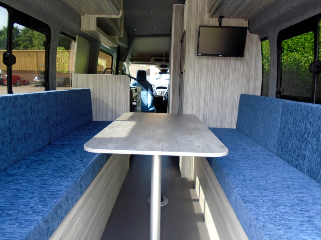 interior of a mobile office van showing meeting table