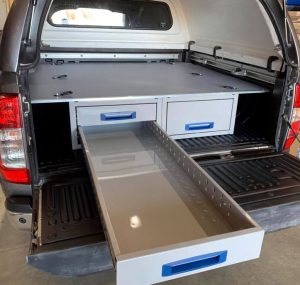 double floor in the rear of a pick up truck with open drawer