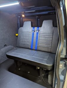 van seating which turns into a bed