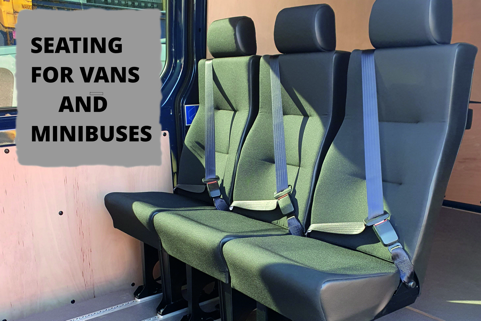 three seat row added to the interior of a van situated behind the drivers seating