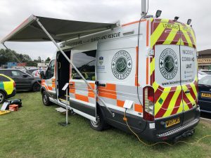 nearside view of a search and rescue vehicle with side awning extended