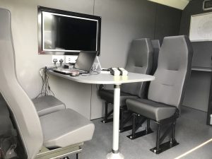 seating and work desk inside van conversion