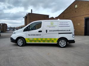 A mobile vet practice vehicle based in a Nissan EV