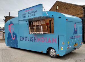 A street food van designed for preparing Halloumi and chips. A swing out panel is shaped and swings out to hide the cab so that the profile looks like a traditional caravan.