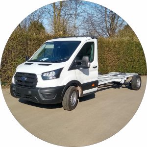 A front nearside photo of the new Ford Transit chassis cab. THis is a white chassis with black front grill.