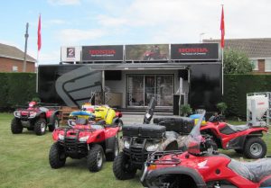 A black exhibition trailer belonging to Honda promoting their ATV's at the Great Yorkshire Country Show