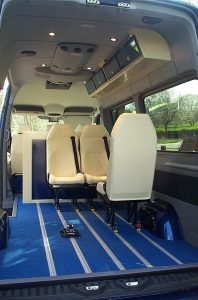 passenger transport vean conversion showing attractive white seating