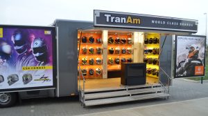 A black boxed chassis cab with open frontage and swing out display panels. Inside can be seen a large display of motorcycle helmets