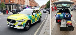 this consistes of two photos. on the left we see a volvo hatch back vehicle with tail lift raised. It is colourered with green and yellow battenburg and marked as an ambulance. The second photo is facing into the rear to show what equipment emergence response vehicles carry on board.
