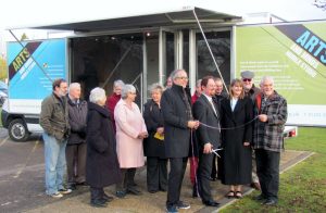 This community support vehicle features two swing out display panels and a fully glazed frontage with double glazed doors providing access. A full length roll out awning provides shelter over the glazed frontage.