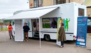 A large mobile library converted into a community support vehicle for rural areas in cambridgeshire.