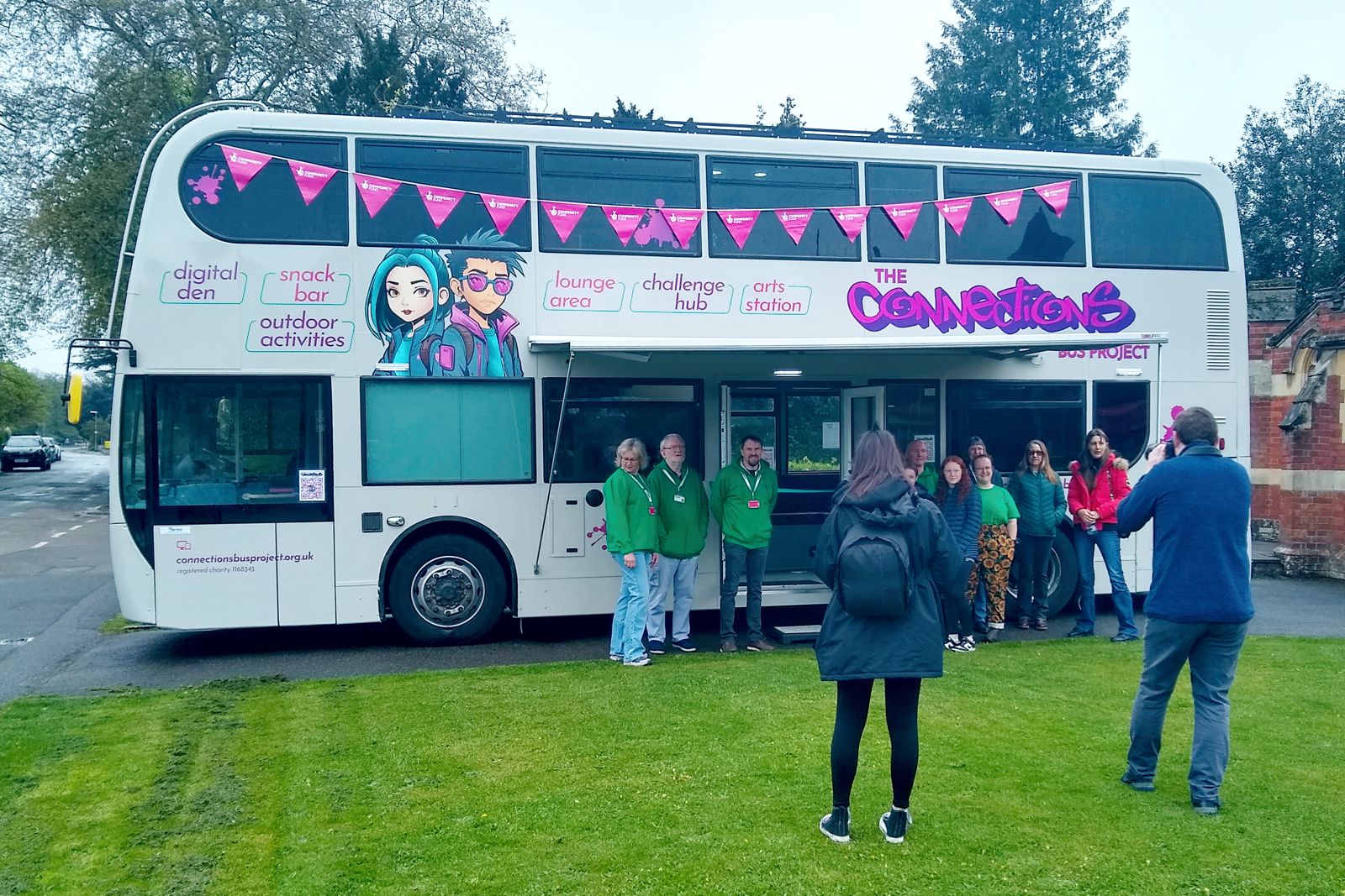 This youth club double deck bus conversion is painted in silver and features a rool out awning over the entrance door. This community support bu is designed to provide a mobile club for teenagers in rural areas.