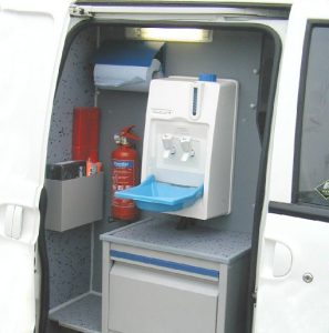 Our range of dog van conversions for Business and pleasure are based on our animal ambulances. This photo shows the hand wash and storage cabinets built within the inside door of an animal ambulance, which is also fitted with two dog kennels to the rear