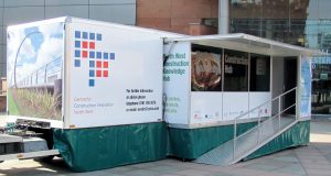 An unusual gull wing extension featuring a lift-up canopy with a hinged down platform featuring a drop-down wheelchair ramp and fold-out glazed walls.